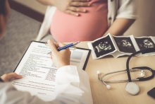 Pregnant woman with doctor
