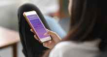 woman checking period tracking app